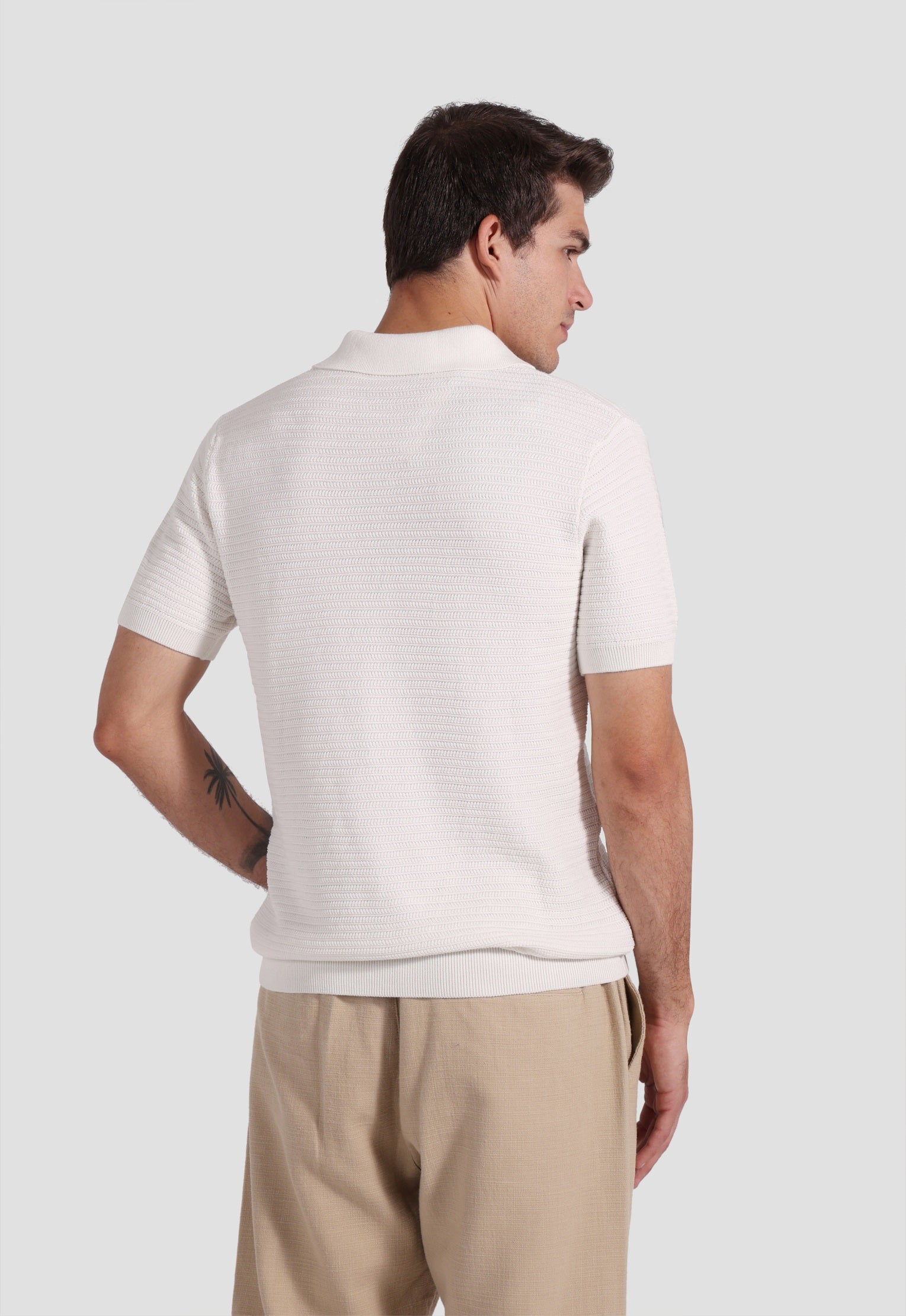 white knitted polo