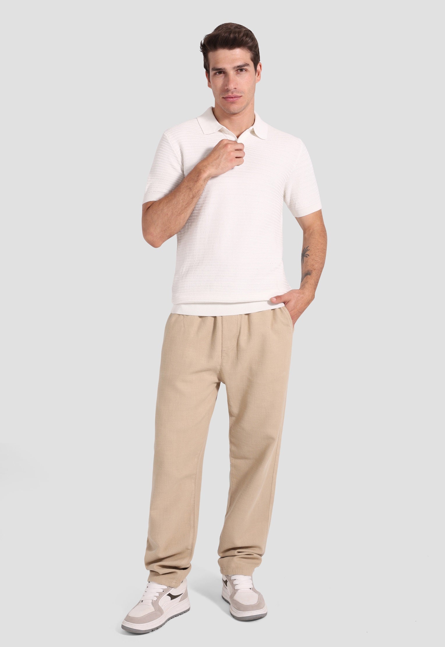 white knitted polo